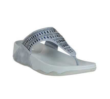 Light blue wedge sandal with geometric cutout design and rhinestone accents on white background